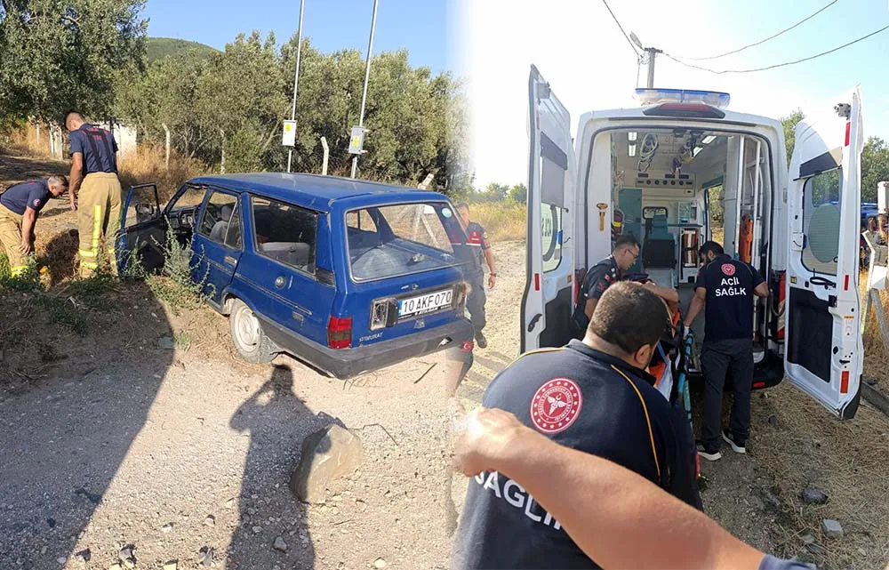 Erdek'te meydana gelen tek yönlü trafik kazasında sürücü, devrilen araçta sıkıştı ancak kurtarıldı.