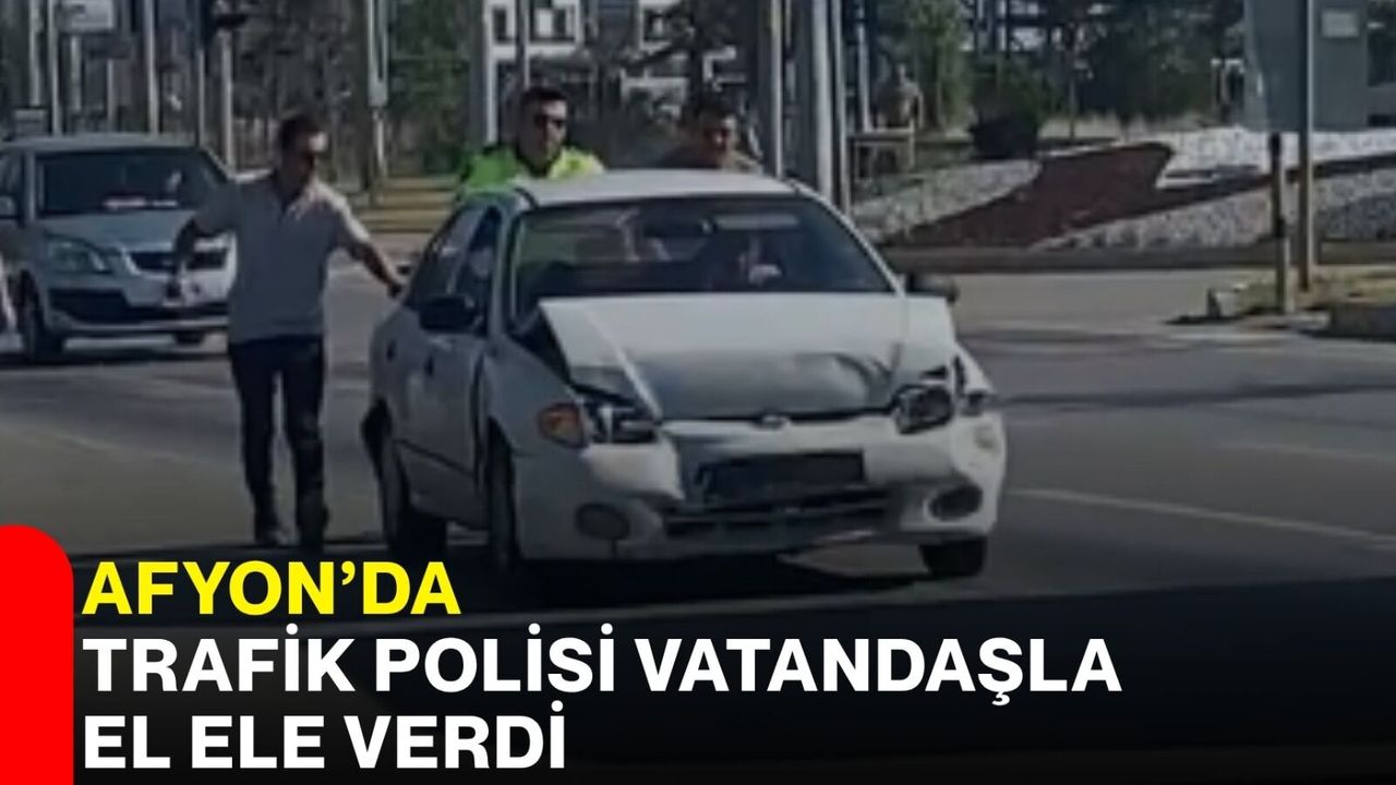 Afyon’da trafik polisi vatandaşla el ele verdi